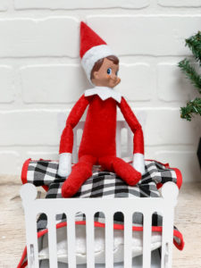 Elf on a Shelf in a bed