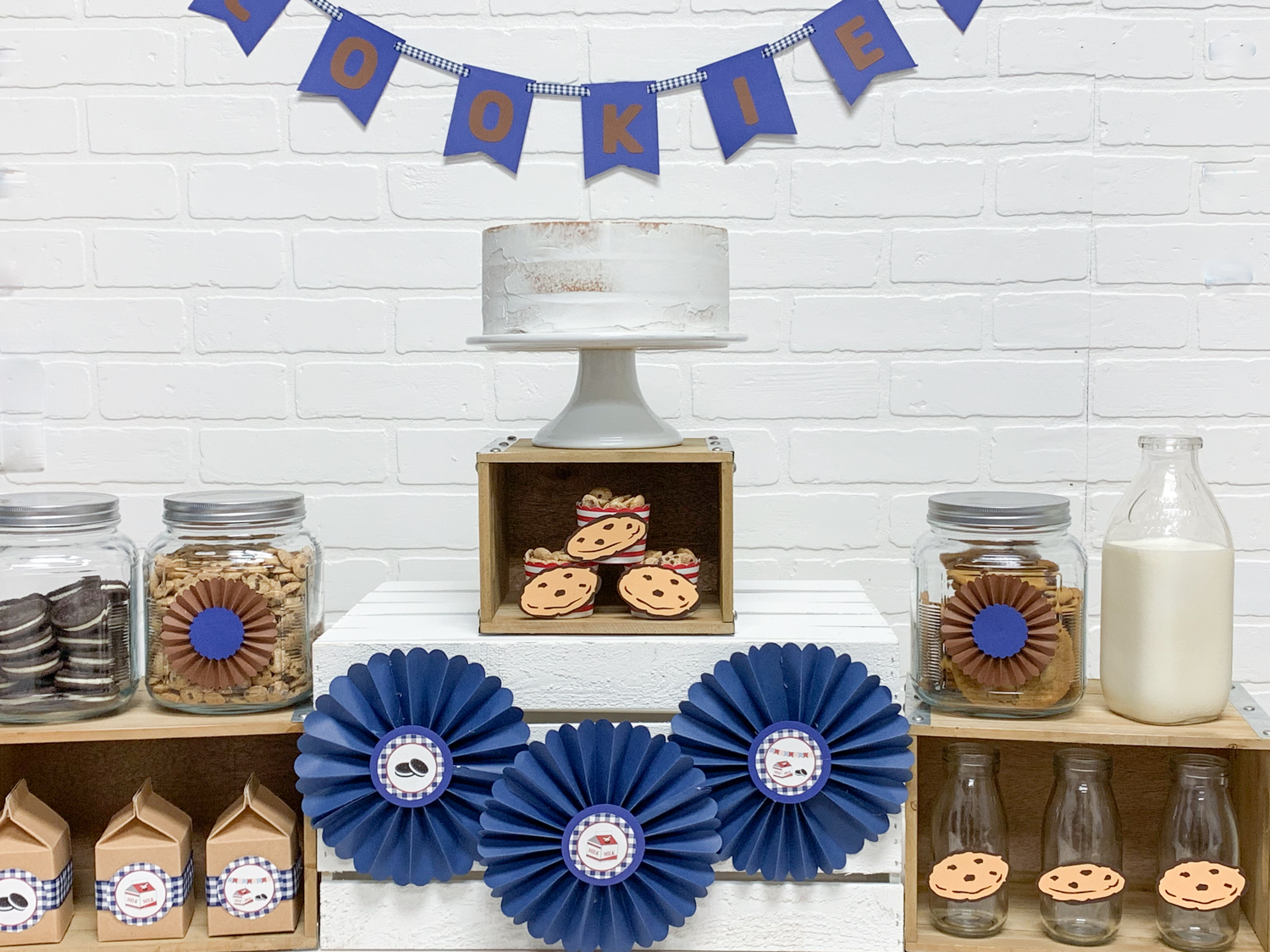 Party Table White Cake Cookies Paper Rosettes Blue Banner