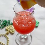 Squeeze orange juice into Hurricane Cocktail