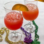 Two Hurricane Cocktails Mardi Gras Beads