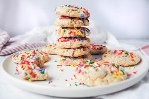 Vegan Rainbow Sprinkle Cookies Stacked on a Plate