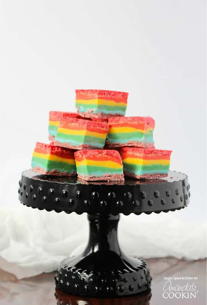 Rainbow fudge squares on a black cake plate