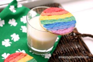 Rainbow Cookie on a Glass of Milk With a Shamrock Towel