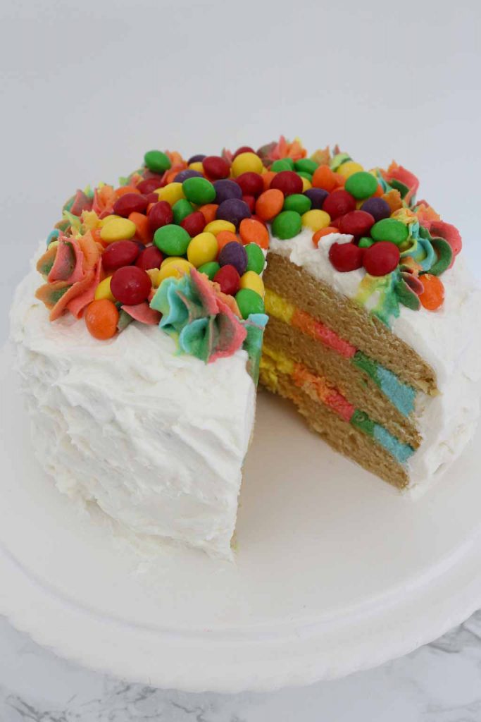 Vegan Rainbow Cake with white frosting