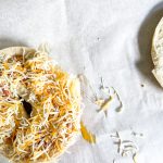 Bagel and shredded cheese